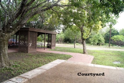A courtyard area with a shaded gazebo