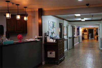 Interior hallway of a nursing facility with a reception area