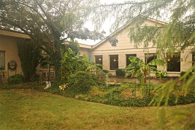 Exterior view of a nursing and rehab facility garden area