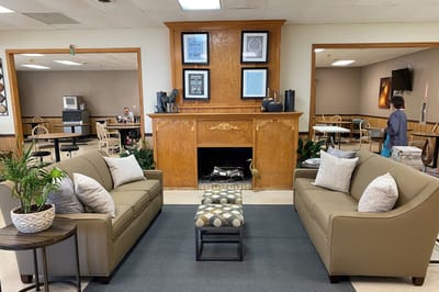 Cozy common area with seating and artwork