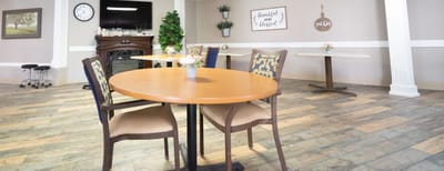 Cozy interior view of a common area with tables