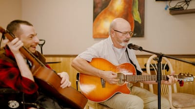Residents enjoying live music in a common area
