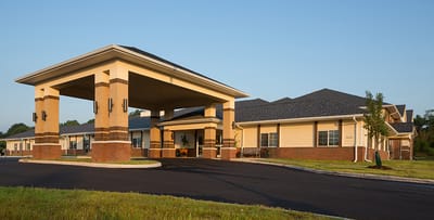 Potomac Falls Health and Rehab Center, Nursing Home in Sterling, VA — Exterior view of a senior living facility entrance