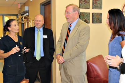 Staff and visitors engaged in conversation