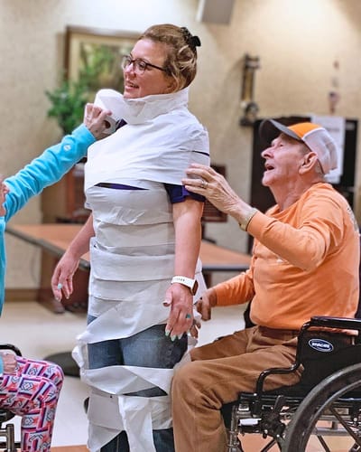 Residents engaging in a fun activity inside the facility.