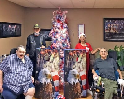 Residents and staff celebrate with patriotic decorations.