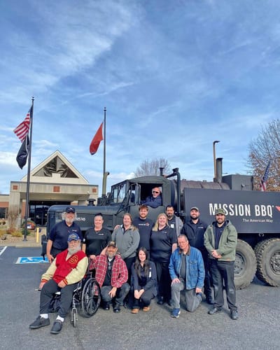 Group of staff and veterans outside the facility