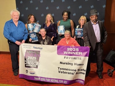Group celebrating an award for the facility