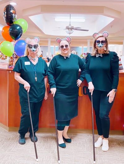 Staff in fun costumes celebrating at the facility