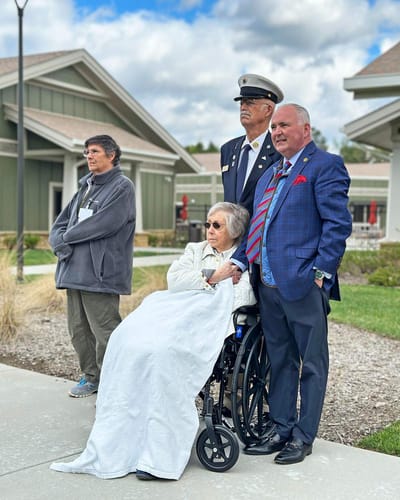 Residents and staff outside the facility.