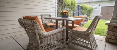 Outdoor seating area with a table and chairs.
