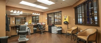 Hair salon interior with styling chairs and equipment