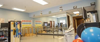 Rehabilitation space with gym equipment and mirrors