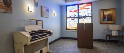 Interior space with an organ and stained glass window