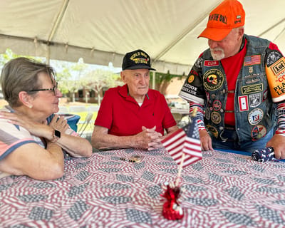 Veterans gathering at an outdoor event.