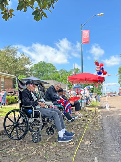 Residents enjoying an outdoor celebration at the facility.