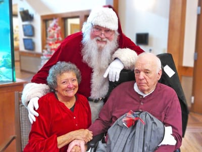 Residents celebrating with Santa Claus during the holidays.