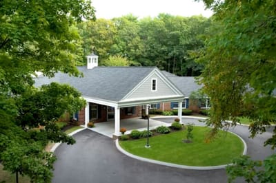 Exterior view of the facility surrounded by greenery.
