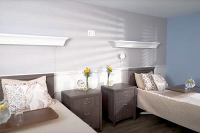Cozy shared bedroom with beds and decor