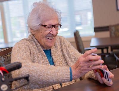 Senior woman enjoying a card game