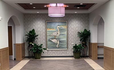 Interior hallway with artwork and plants