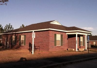Exterior view of a brick building on the facility grounds.