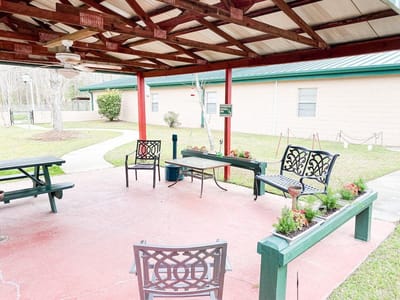Outdoor patio with seating and landscaping