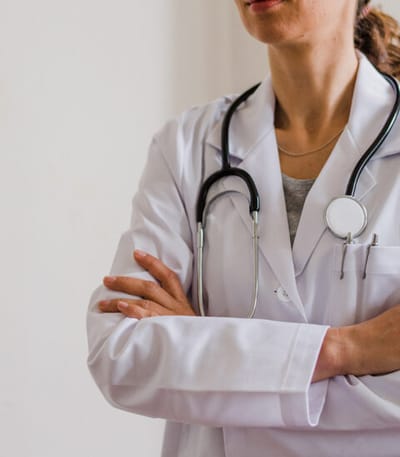 A healthcare professional in a lab coat