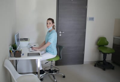 Staff member working at a desk in an office
