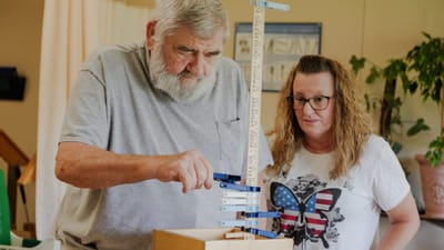 Residents engaging in a games activity indoors