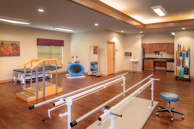 Therapy room with equipment and bright lighting