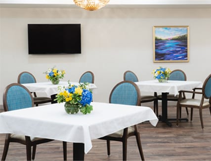 Bright dining room with flower centerpieces