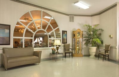 Bright lobby area with seating and plants