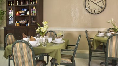 Dining area set with tables and food items