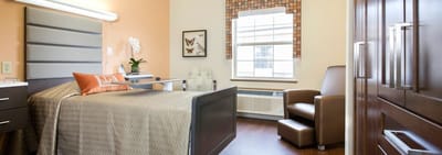 A well-furnished assisted living room with natural light