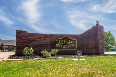 Exterior view of Oak Manor nursing facility entrance