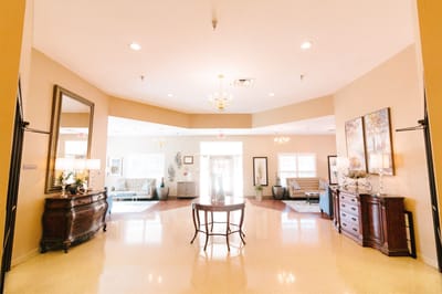A bright lobby area with seating and decor