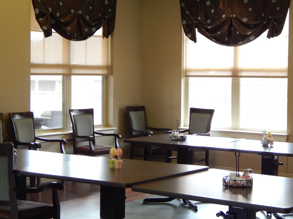 Bright communal area with tables and chairs