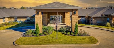 Exterior view of a senior living facility with landscaping