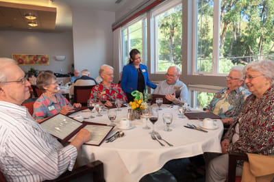 Residents enjoying a meal together in a dining area