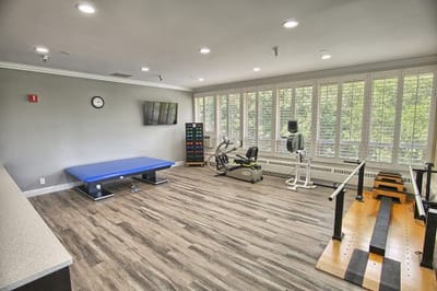 Well-equipped therapy room with exercise equipment