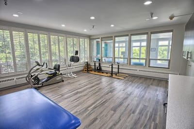 Bright interior view of a fitness area with equipment