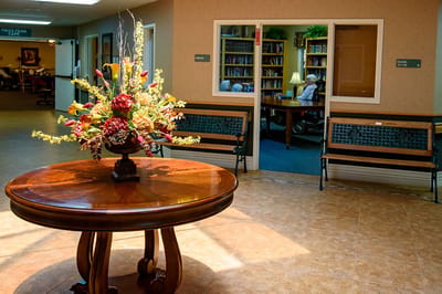 A welcoming lobby with flower arrangement and seating