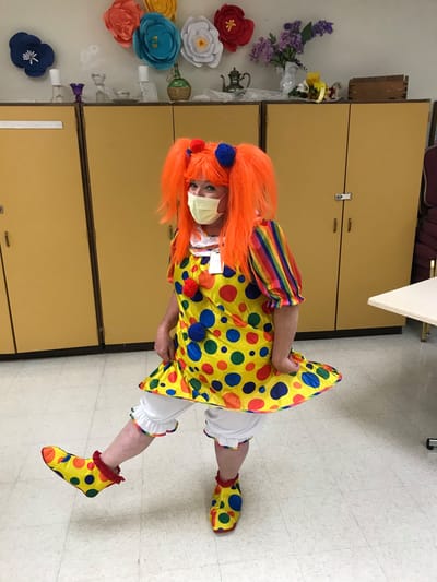Progressive Care Center, Nursing Home in Shreveport, LA — Clown entertaining seniors in a colorful costume and mask