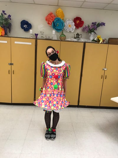 Progressive Care Center, Nursing Home in Shreveport, LA — Clown-themed costume worn by a woman in a colorful room