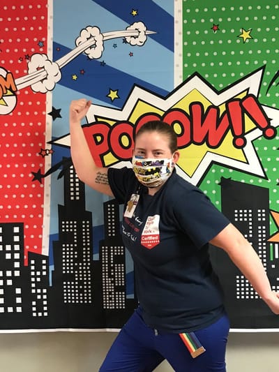 Progressive Care Center, Nursing Home in Shreveport, LA — Staff member posing confidently in front of colorful backdrop