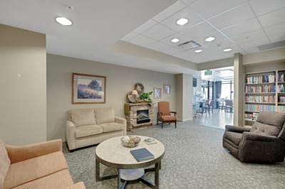 Common area with seating and a bookshelf