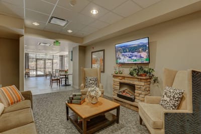 Interior common area with seating and a television