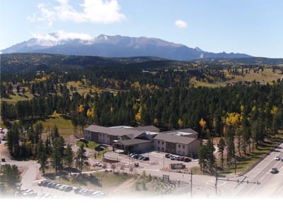 Aerial view of a senior living facility surrounded by nature