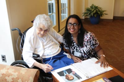 A resident and caregiver engaging in conversation